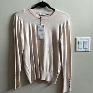 Cream colored soft Zara sweater with gold button sleeves